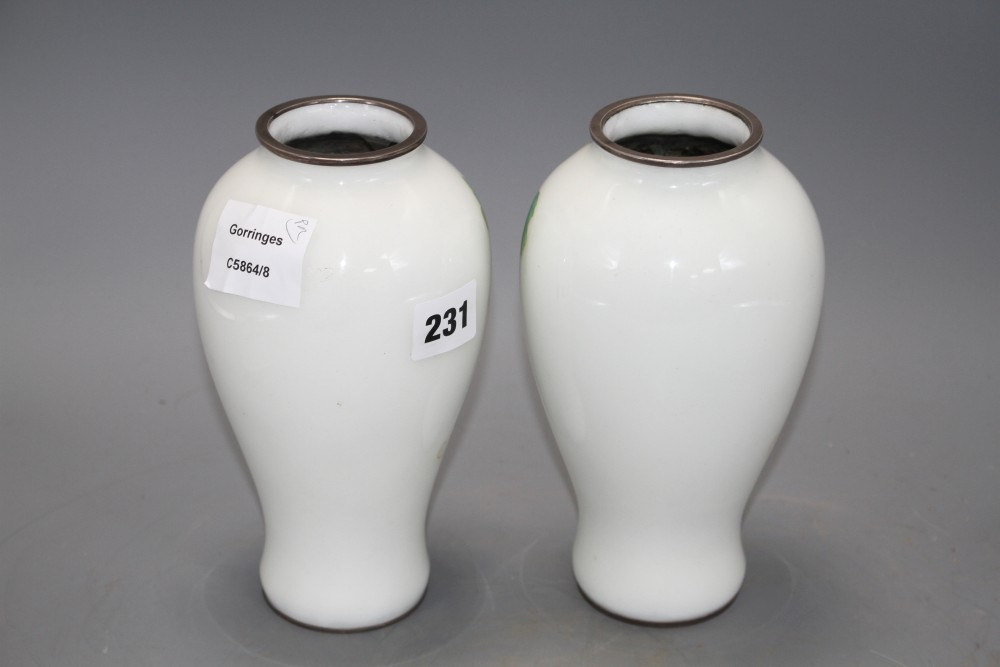 A pair of Japanese cloisonne silver wire vases, decorated with grapes on a white ground, height 18.5cm